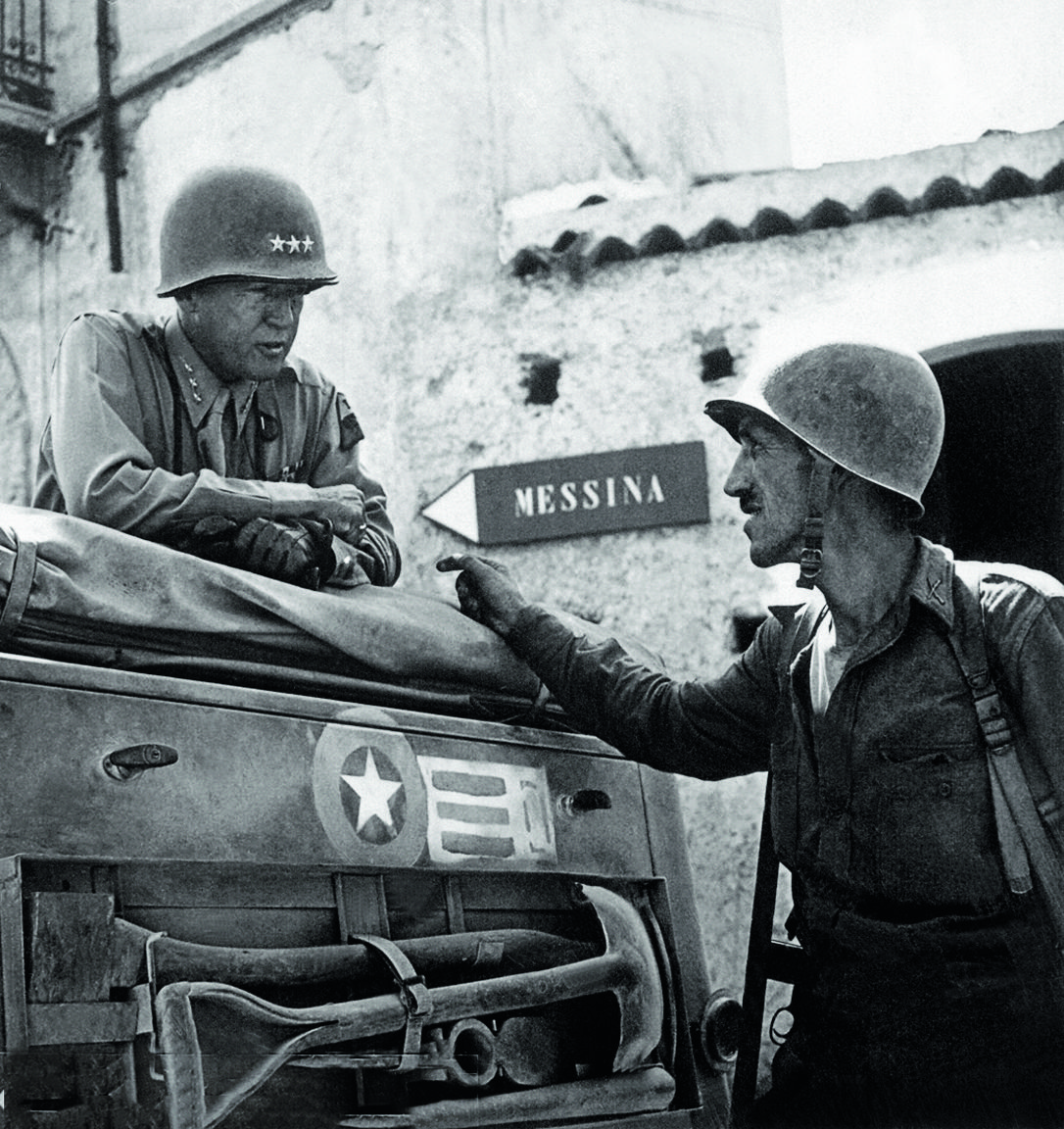 Patton_speaking_with_Lt._Col._Lyle_Bernard,_at_Brolo,_circa_1943.jpg